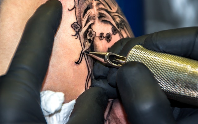 Man getting a first tattoo