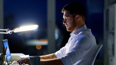 Entrepreneur working on laptop at night