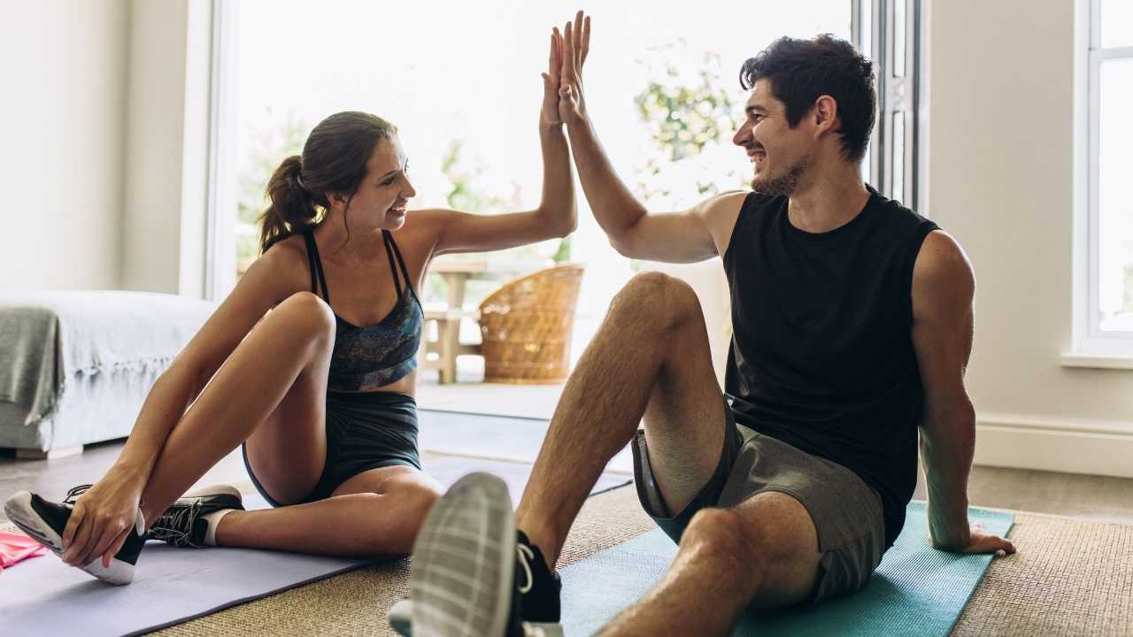 Couple working out in home