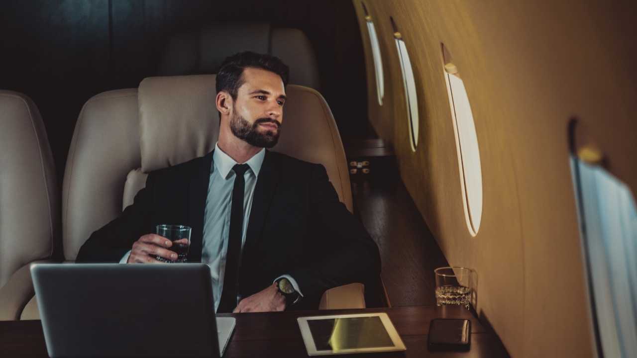 A guy sitting in a private jet