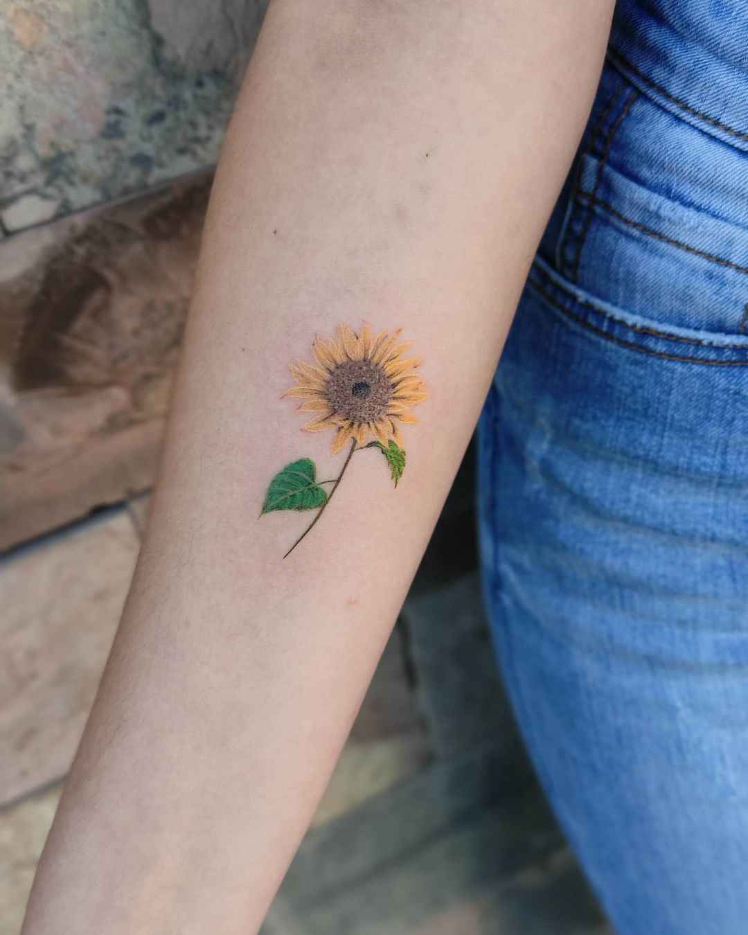 sunflower tattoo on forearm