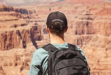 A guy standing at Grand Canyon