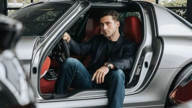 A guy sitting in a car