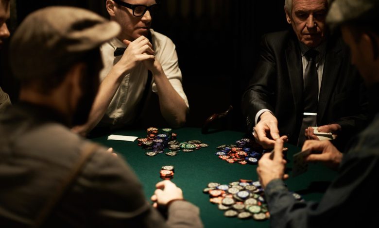 men playing poker at table