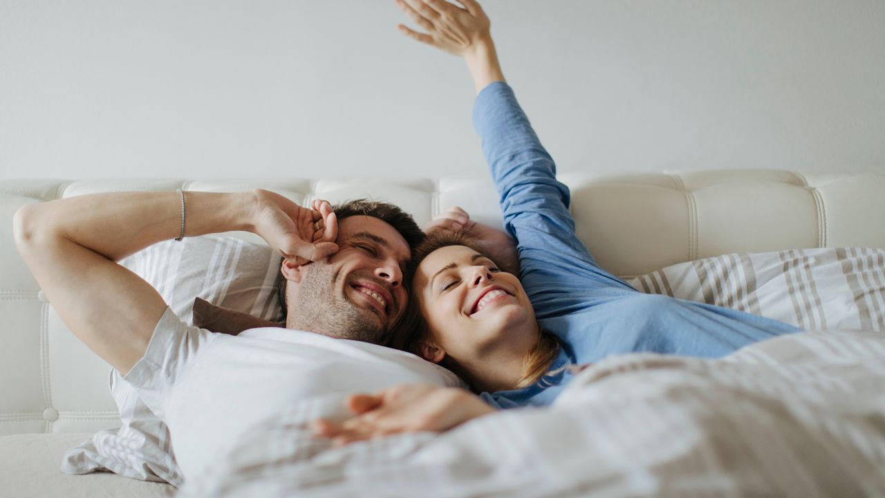 couple in bed waking up