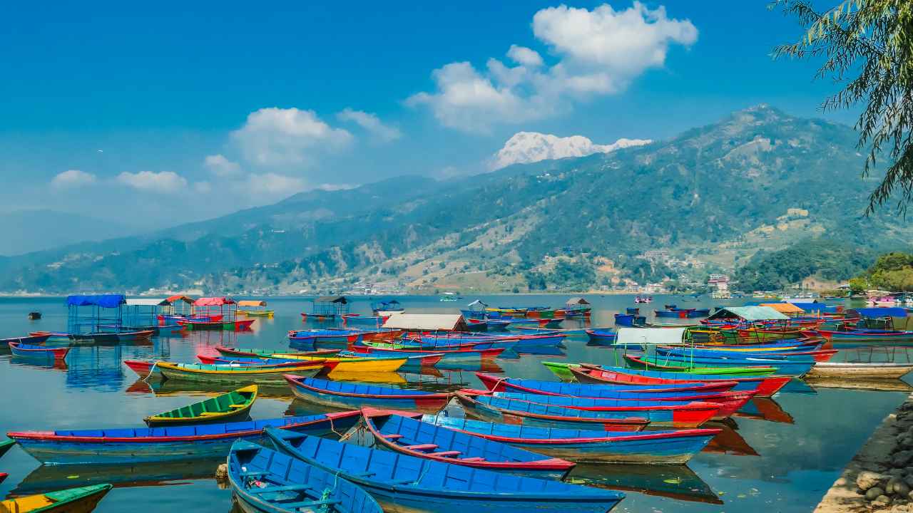 tranquil Phewa Lake in Pokhara, Nepal, an idyllic place to visit, showcasing the country's natural beauty, perfect for those seeking the best budget-friendly travel spots