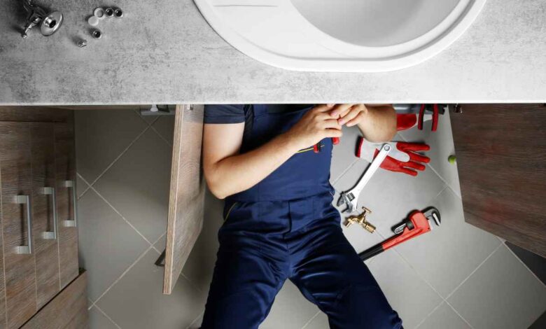 Plumbing Experts working in a home