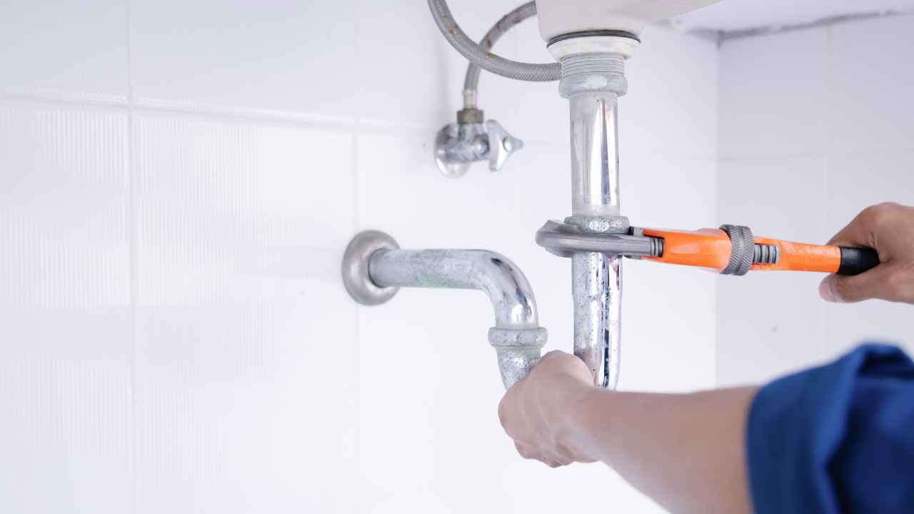 Plumbing guy working in a home